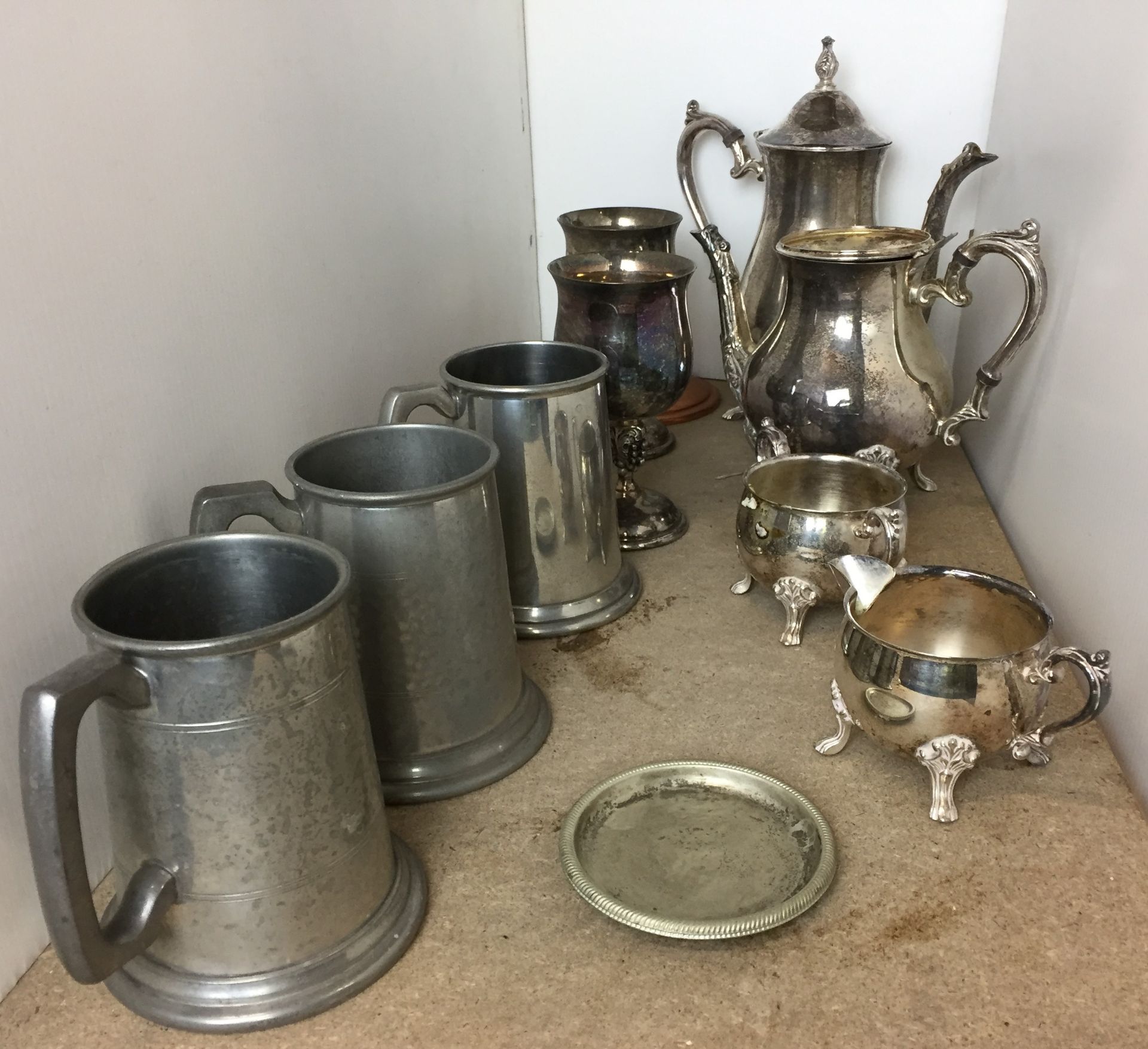 Ten items - silver plated four piece tea/coffee set (detached lid to teapot) and two goblets,