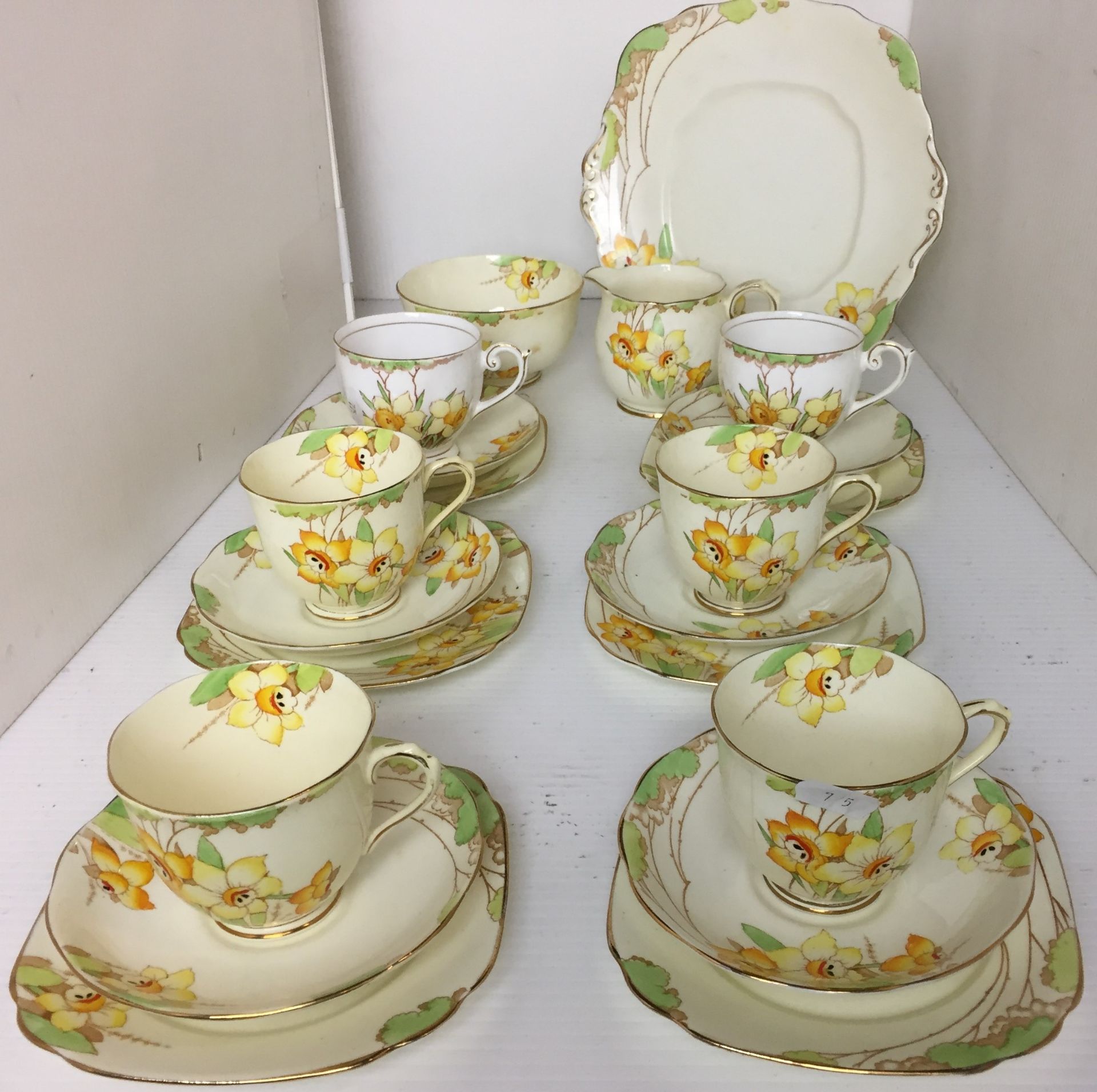 Twenty one pieces including nineteen Royal Albert Daffodil tea set (one cup cracked) and two white