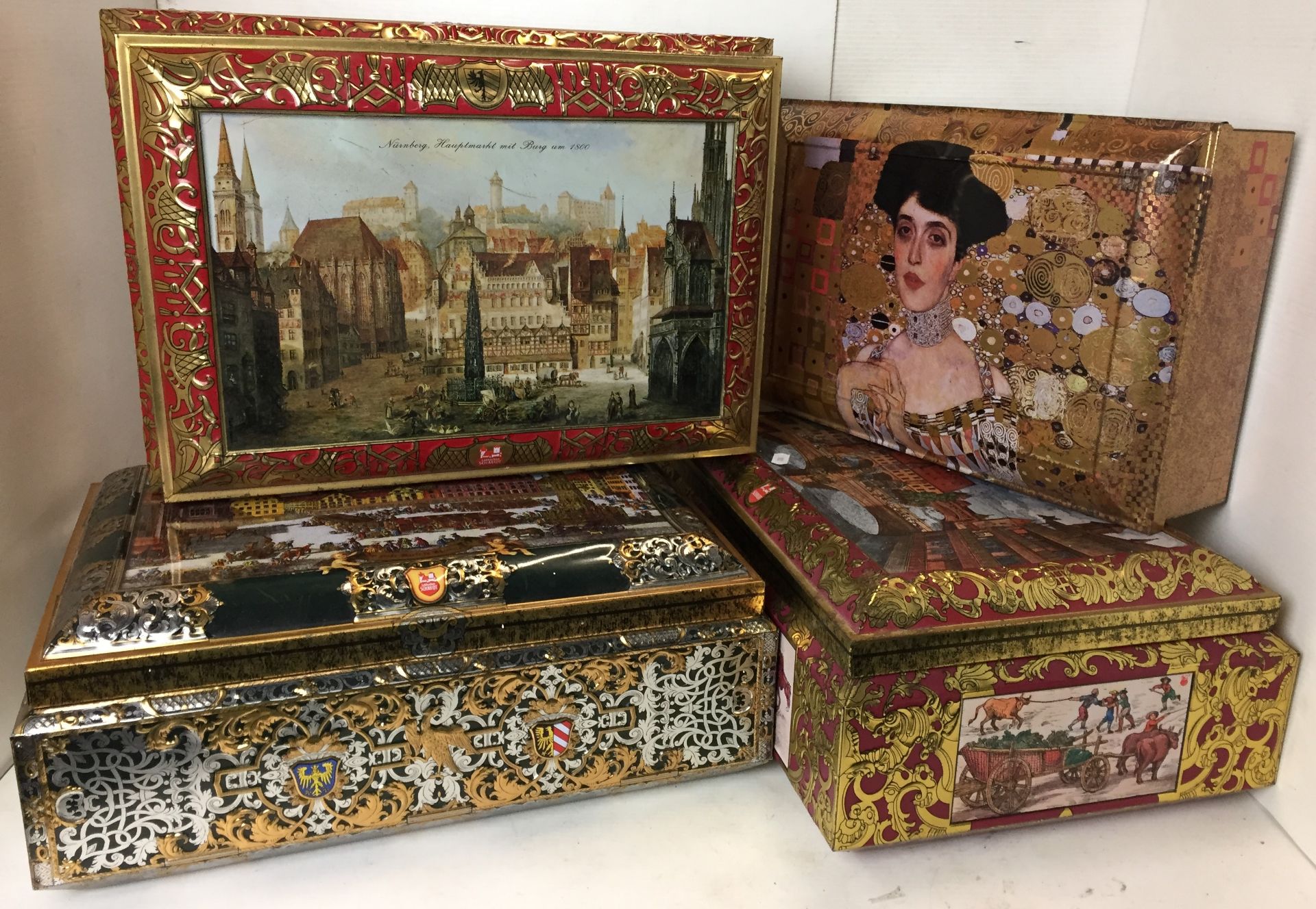 Four large lidded tin chests 42x30x16cm high and 37x26x13cm high all stamped Nurnberg Germany,