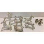 Eleven items including eight white horses max height 8cm and three miniature steins 3.