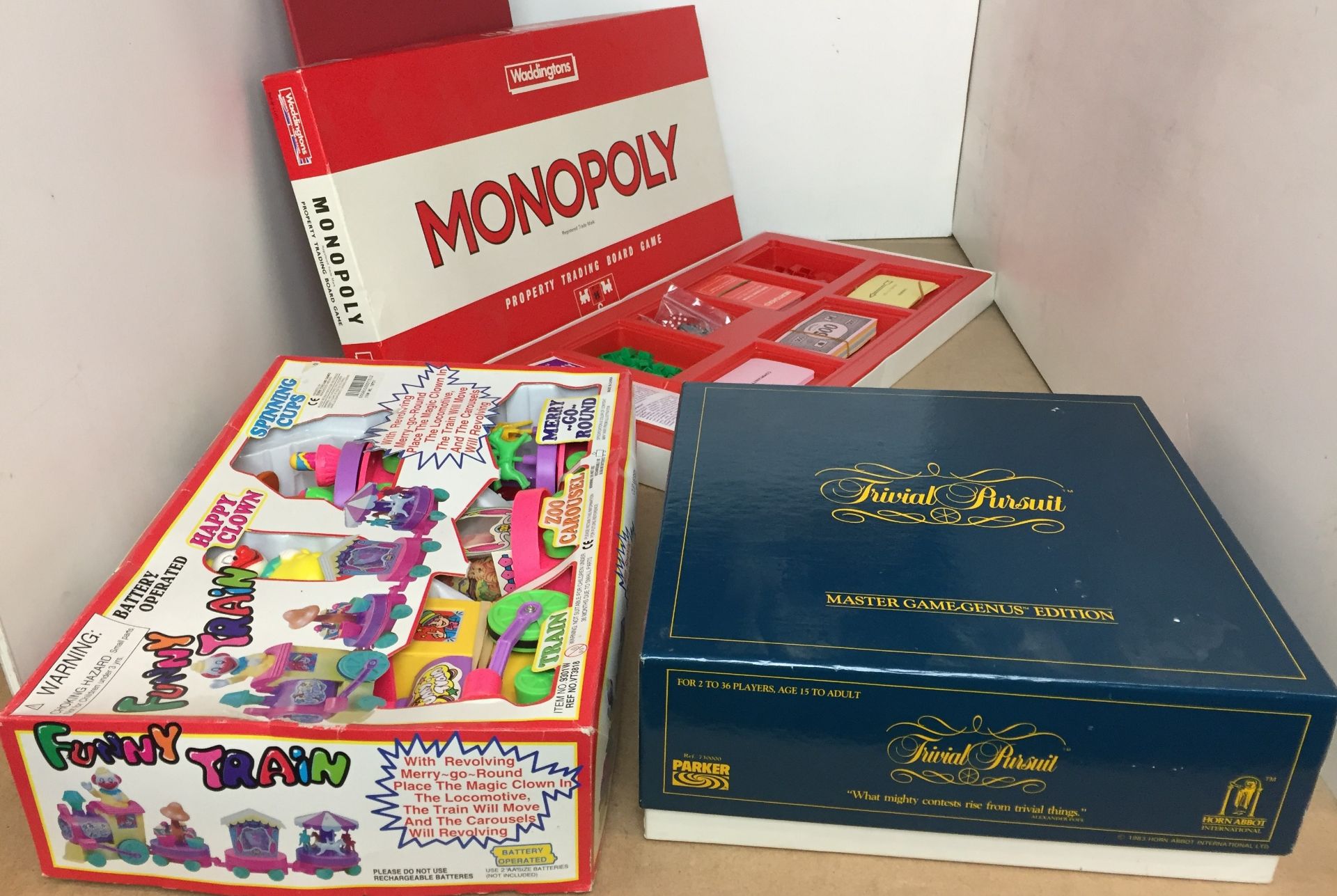 Three games including Monopoly with metal pieces,