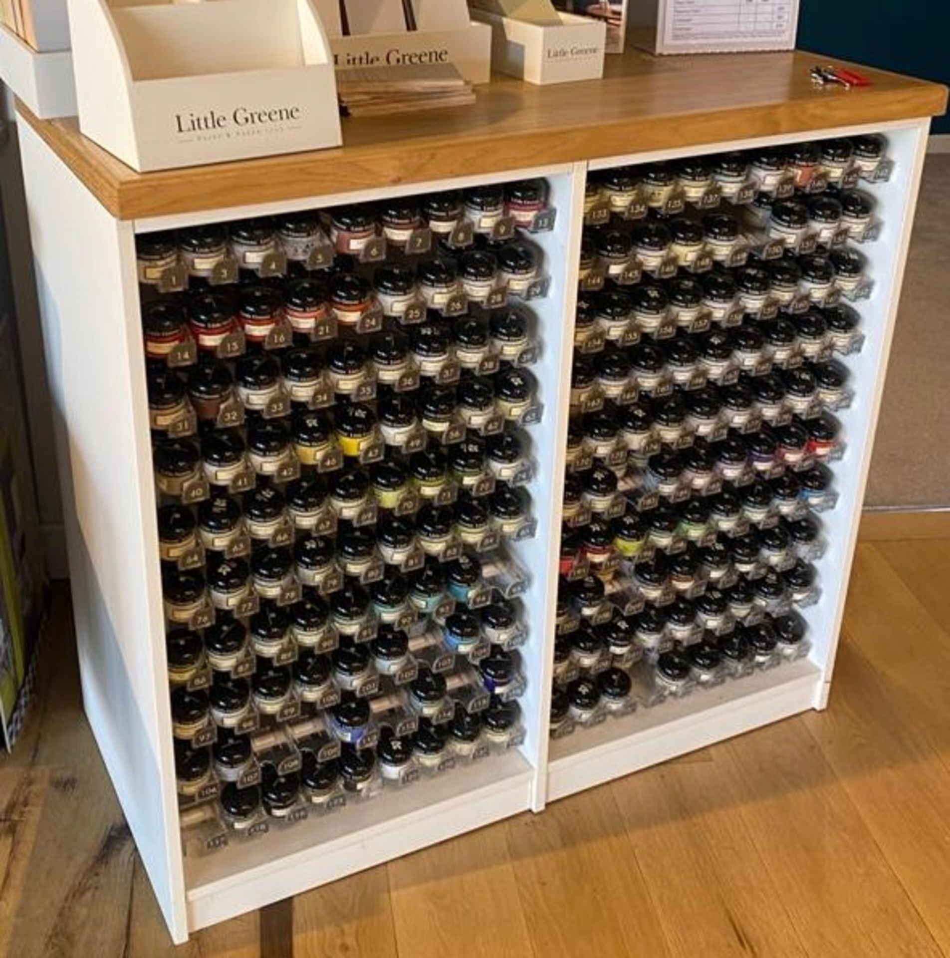 Wooden display unit comprising multiple shelves to display Little Greene English Heritage sample