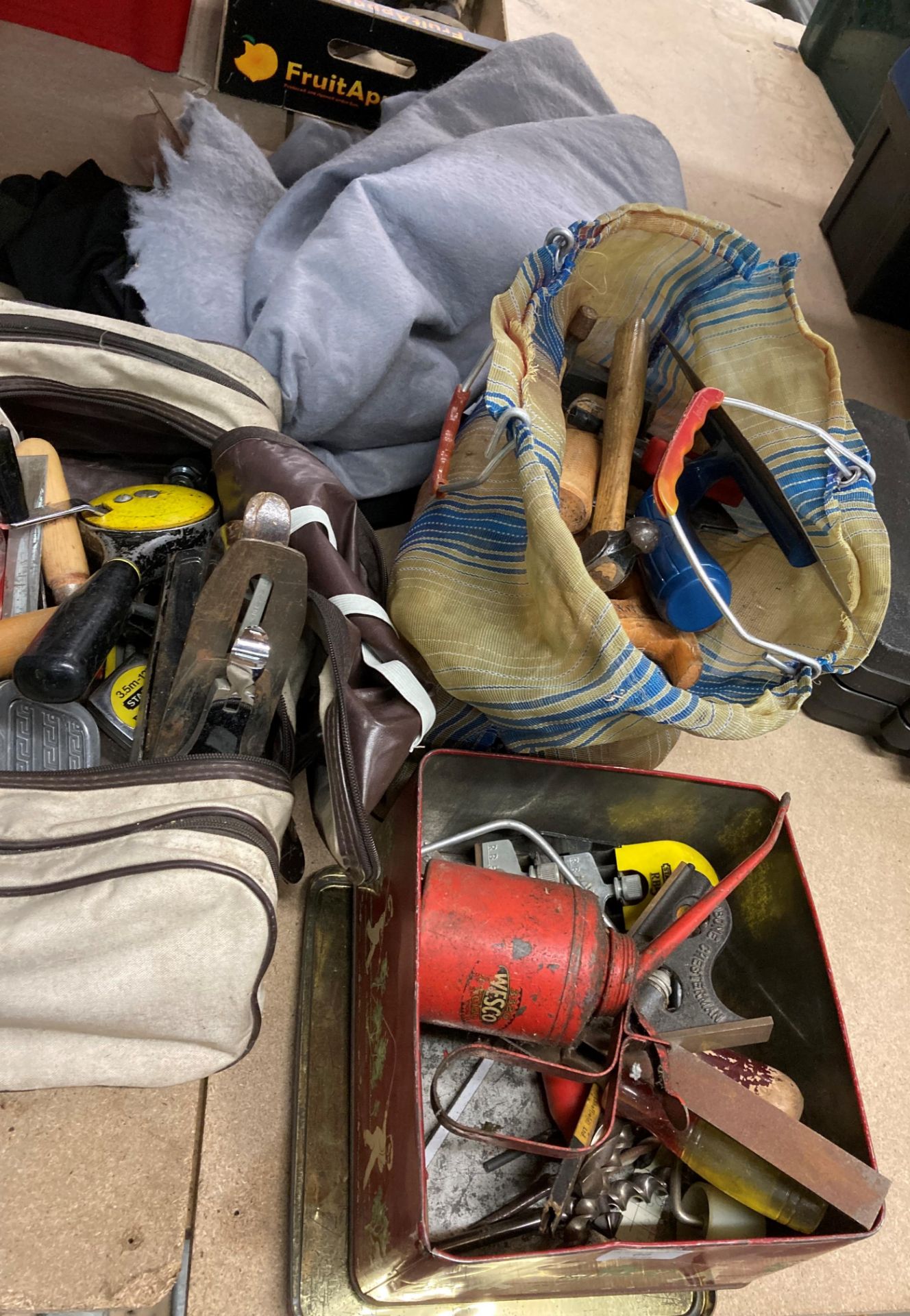 Contents to 2 bags and metal tin of assorted tools including chisels, hammers,