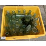 Contents to yellow plastic crate - approximately twenty eight mainly green glass bottles (S1)