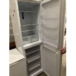 An Indesit DBIAA 344F tall upright fridge freezer (P0)