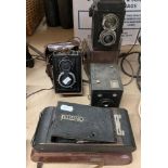 A Kodak Eastman no 1 folding camera in case, a Lubitel 2 camera in case,