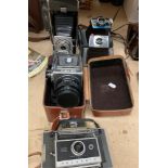 A Polaroid 120 camera with folding lens,