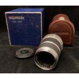 A Voigtlander Super-Dynarex 1:4/135 lens No: 5057836 in brown leather case and a Voigtlander blue