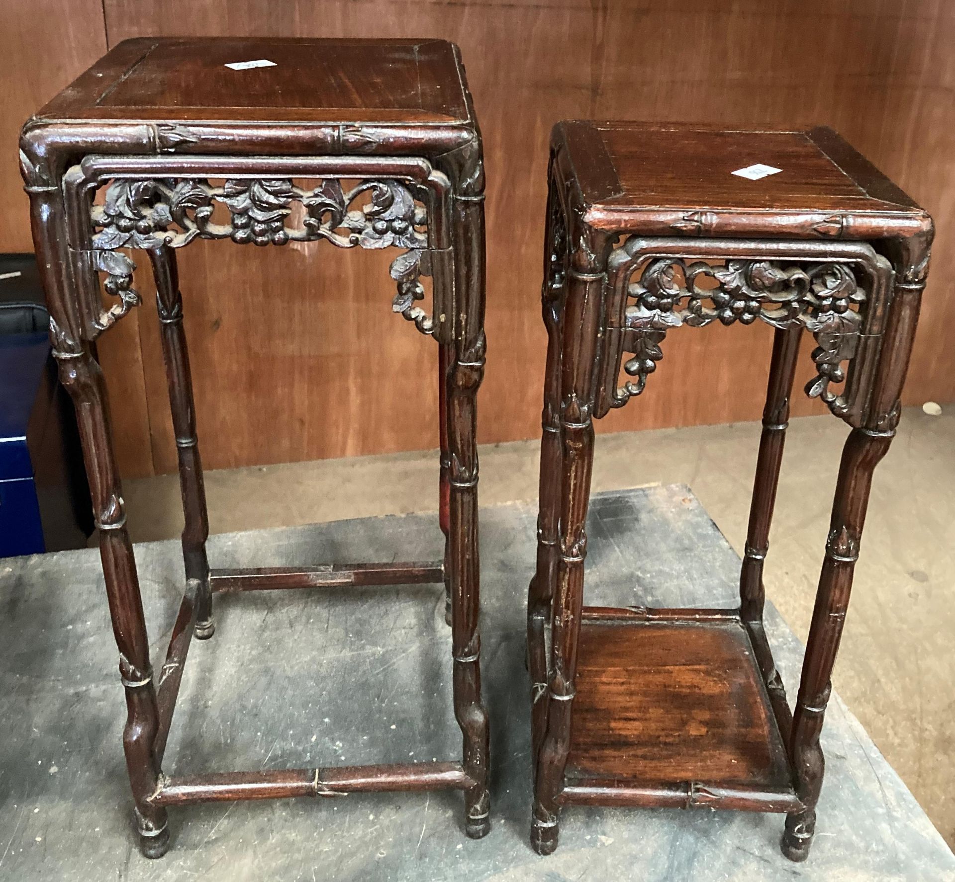 A nest of two small Chinese hardwood tables.