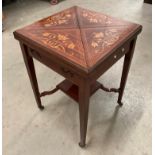 A mahogany envelope table which converts into a games table with centre green leather finish top