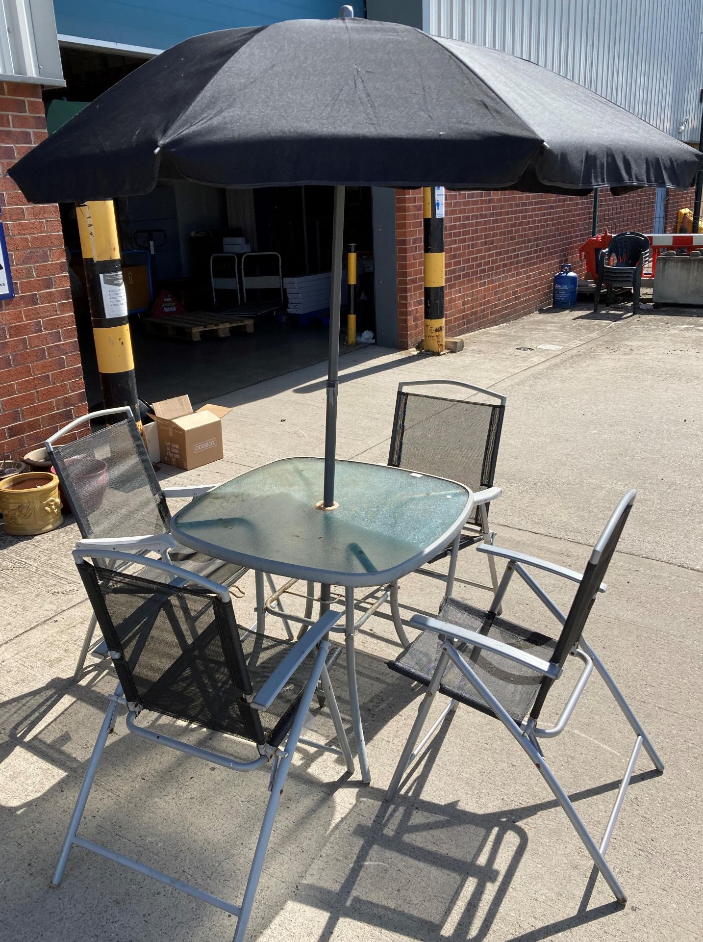 A grey metal patio set comprising table with glass top 80cm x 80cm, - Image 2 of 2