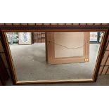 A wood framed wall mirror 60cm x 84cm