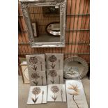 A silver coloured framed wall mirror 50 x 40cm,