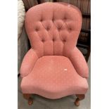 A Jade peach patterned fabric button back nursing chair