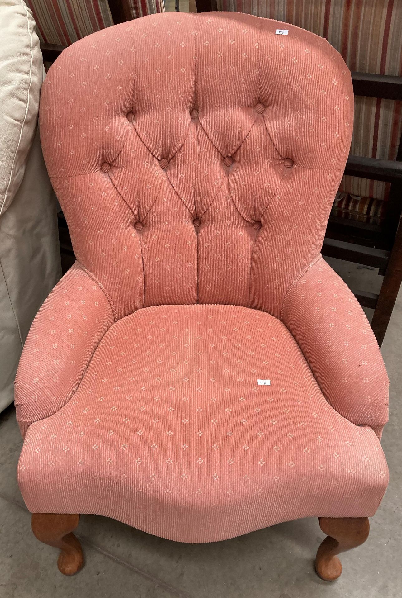 A Jade peach patterned fabric button back nursing chair