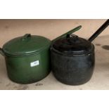 Two large metal cooking pans with lids in green and black