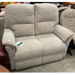 An Oaktree mobility oatmeal upholstered two seater settee