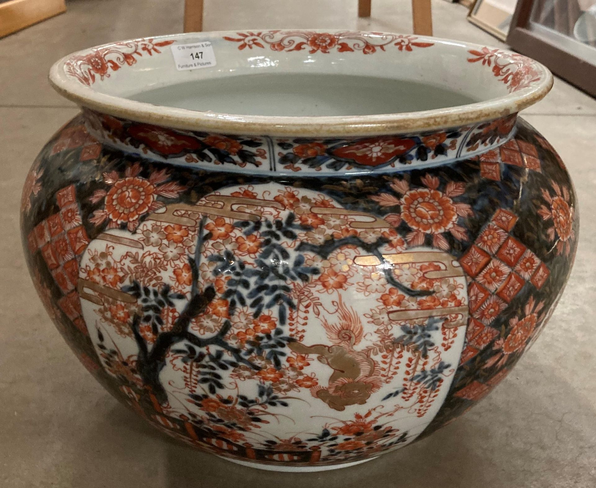 A Chinese imari patterned jardiniere 26cm high and 32cm diameter.