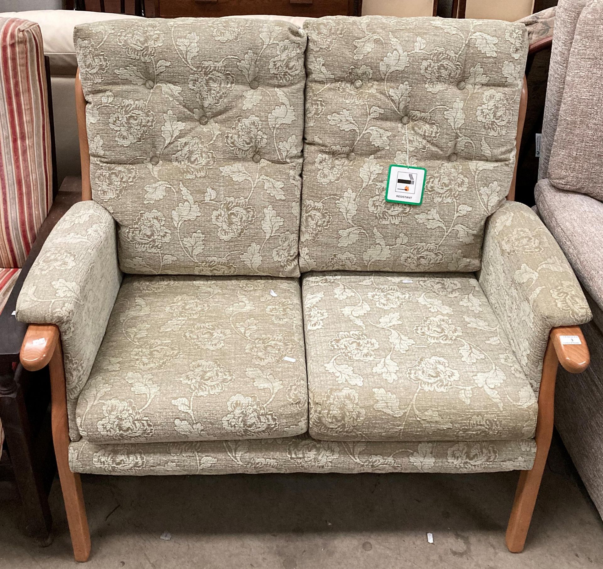 Beige material floral patterned 2 seater high back settee