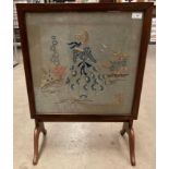 A mahogany framed folding fire screen/table with needlework panel 49cm x 49cm