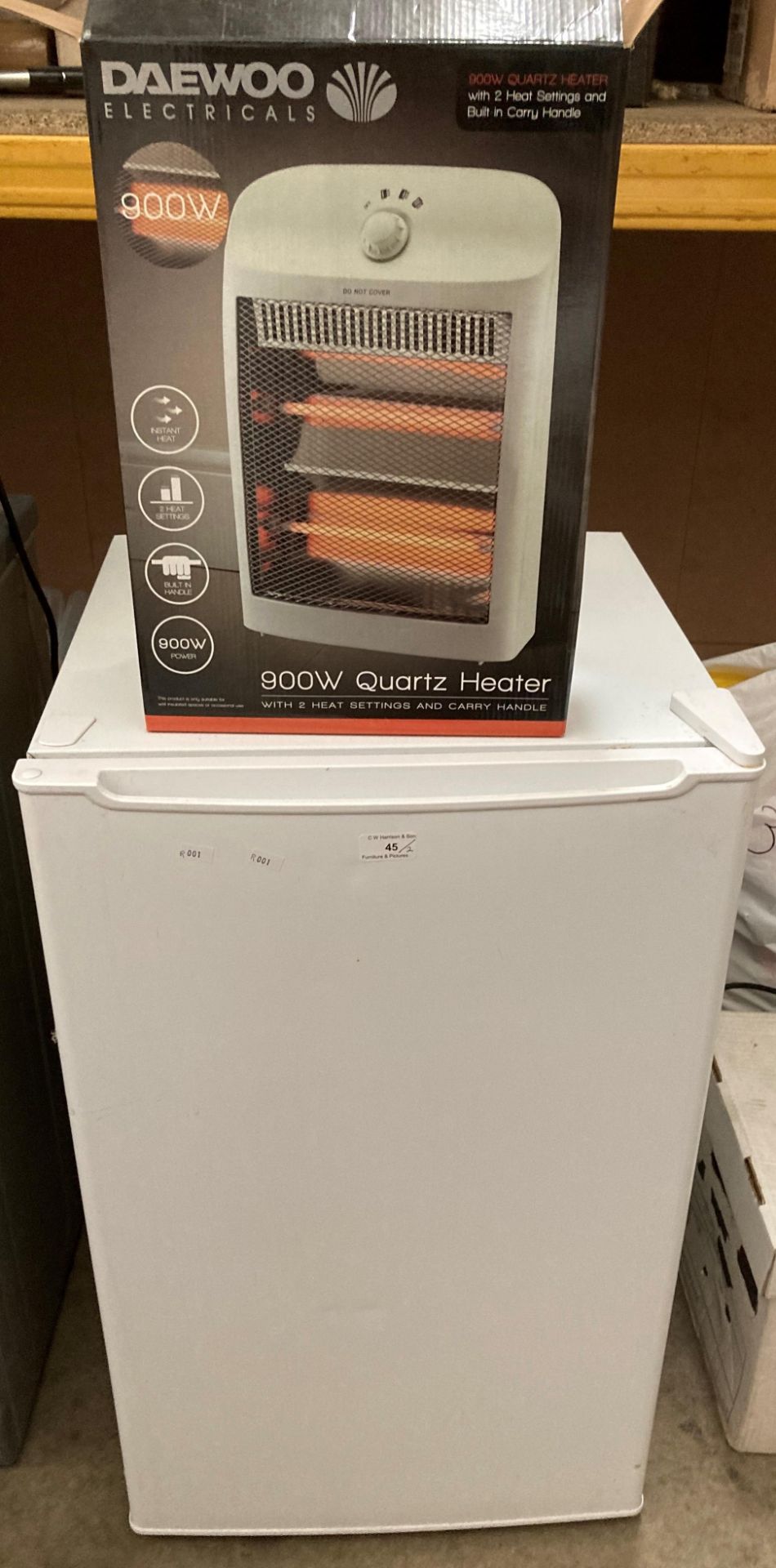 An Essentials larder under the counter fridge model no: CUL50W20 and a Daewoo 900 watt quartz