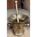 A brass mortar and pestle.