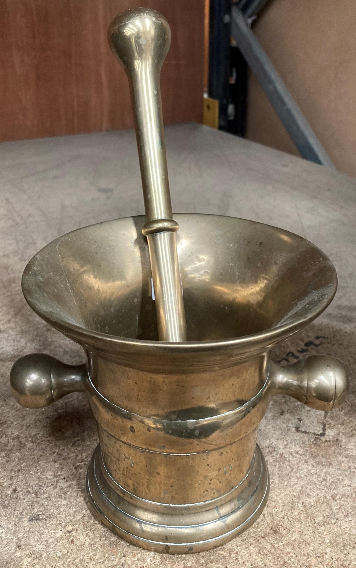 A brass mortar and pestle.