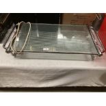 A chrome framed table top warming tray 64cm x 36cm