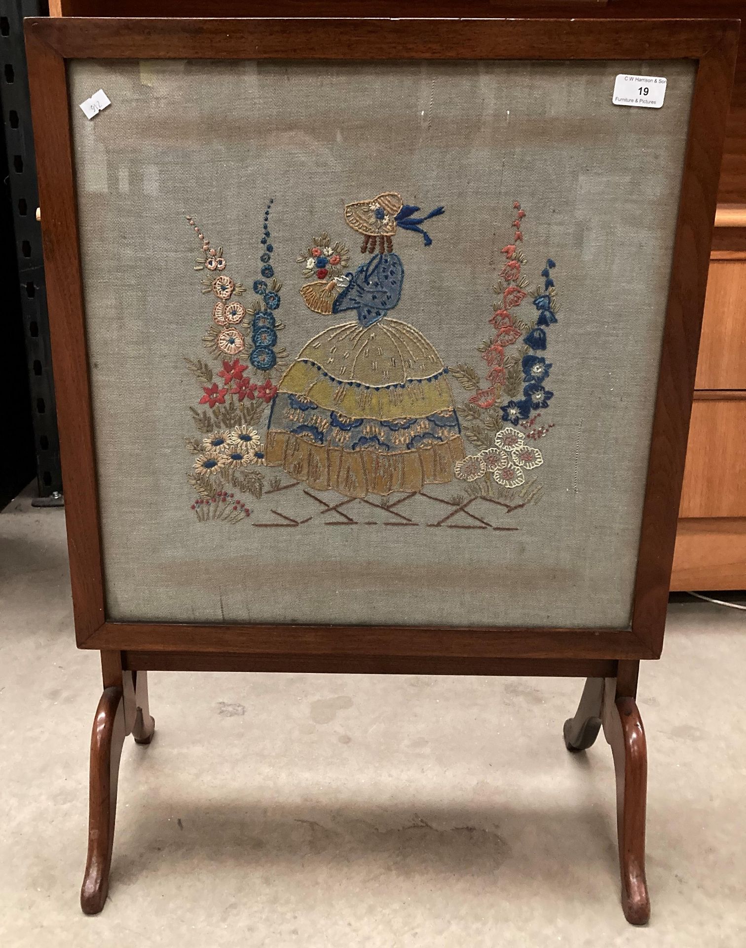 A mahogany framed folding fire screen/table with needlework panel 49cm x 49cm