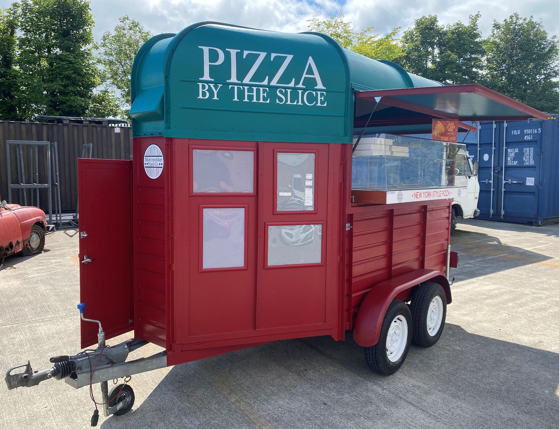 TWIN AXLE HORSE BOX CONVERTED TO A PIZZA/CATERING TRAILER with red and green panels and New York