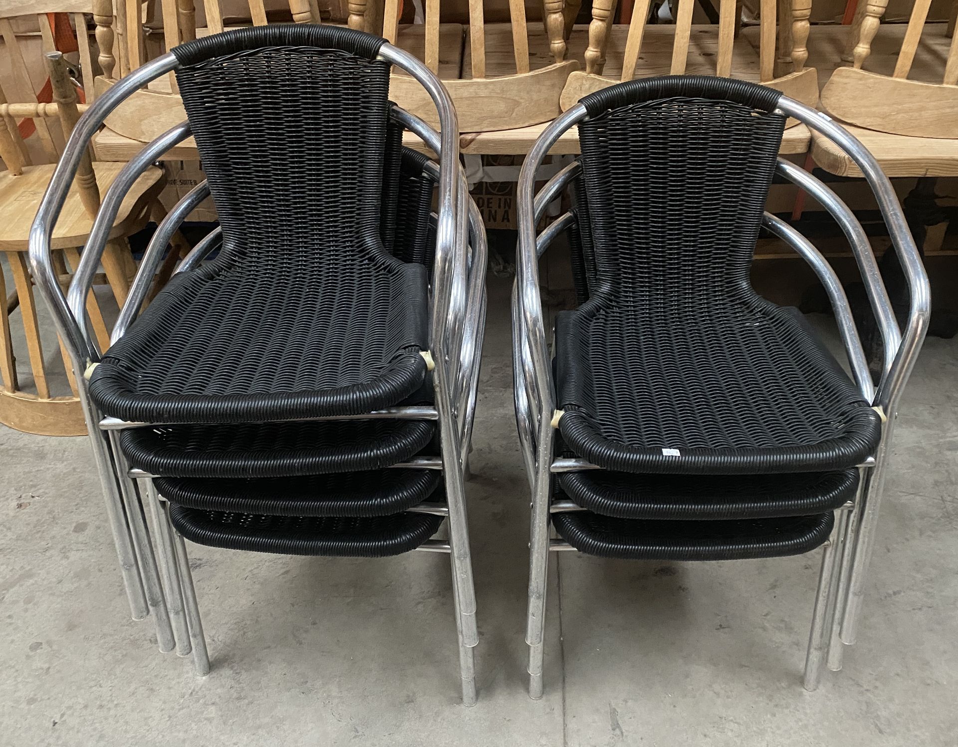 7 x Chrome Framed Stacking Outdoor Armchairs with Black Plastic Weave Seats