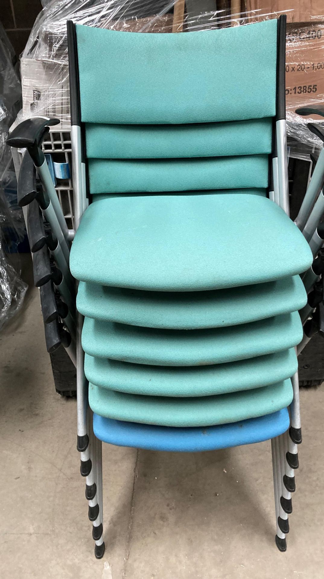 6 x metal framed stacking chairs with arms - 5 green and 1 blue cloth upholstered.