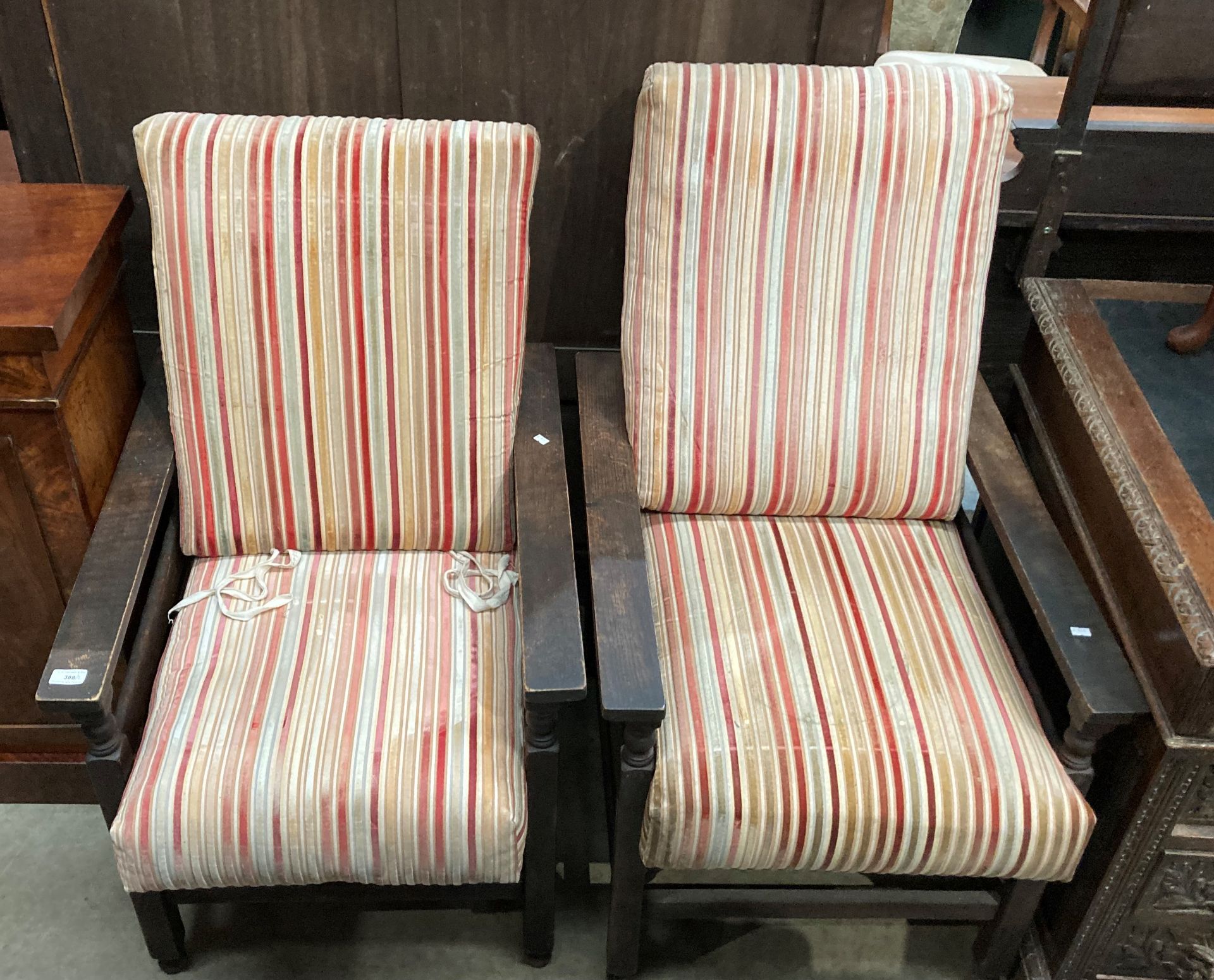 A pair of oak framed armchairs with red, orange and pink fabric seats and backs. - Image 2 of 3