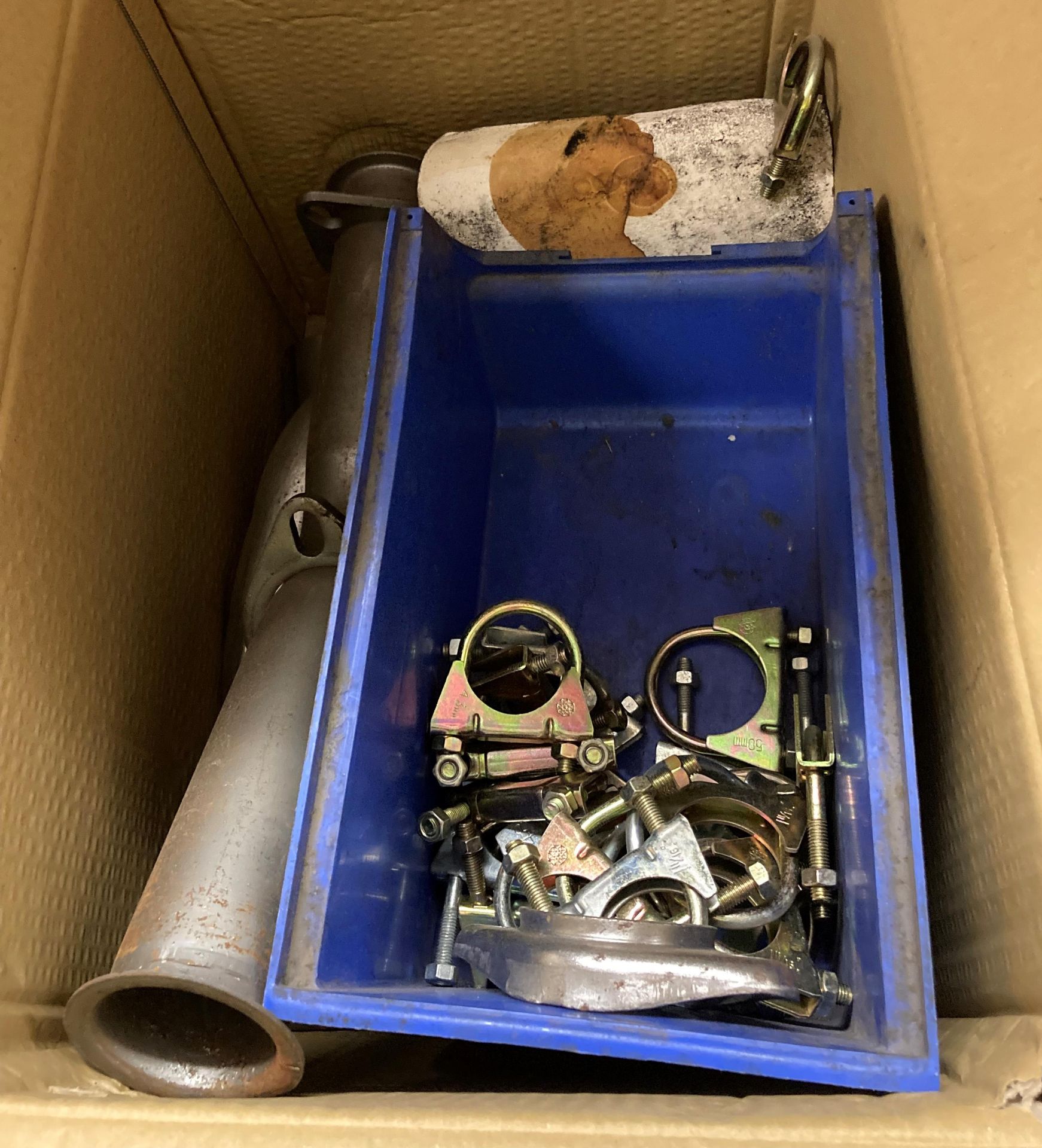 Box and contents including 6 x exhaust header connection kits, 26 x exhaust clamps, cat bypass pipe,