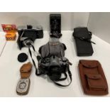 Contents to tray - three assorted cameras including Canon AE-1 program with a 50mm lens,