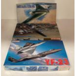 Three assorted model aircraft by Dragon including YF-23 1:72 scale,