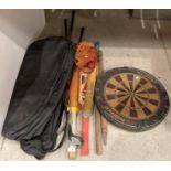 Assorted sports equipment including Unicorn "Hustler" dartboard, a baseball mitt,