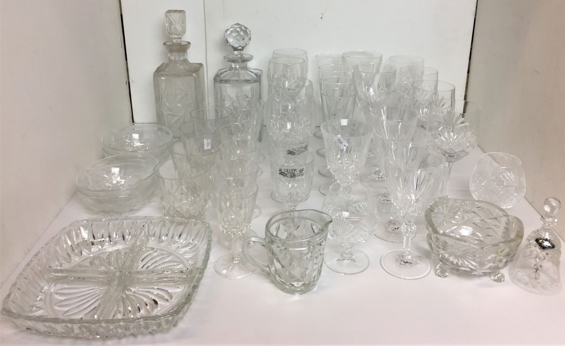 Forty plus items of glassware including two whisky decanters one with four matching tumblers,