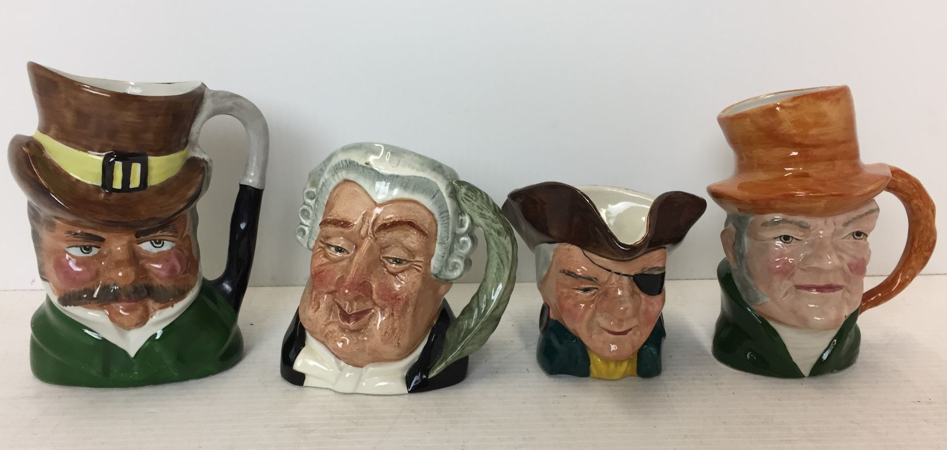 Four character jugs Royal Doulton - Lawyer, Ridgway - Pirate,