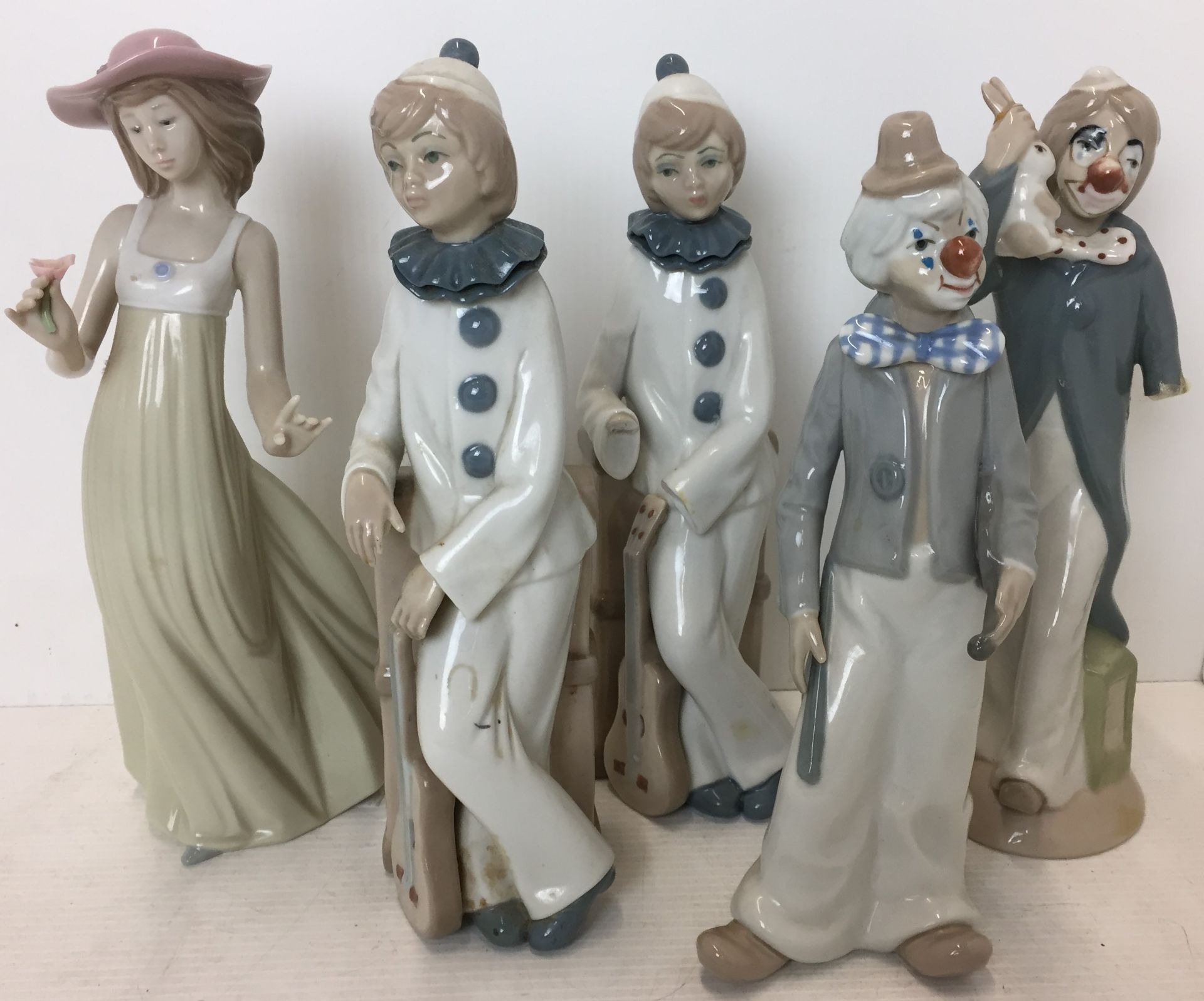 Five figurines Lady with Flower by Lladro (three missing fingers),