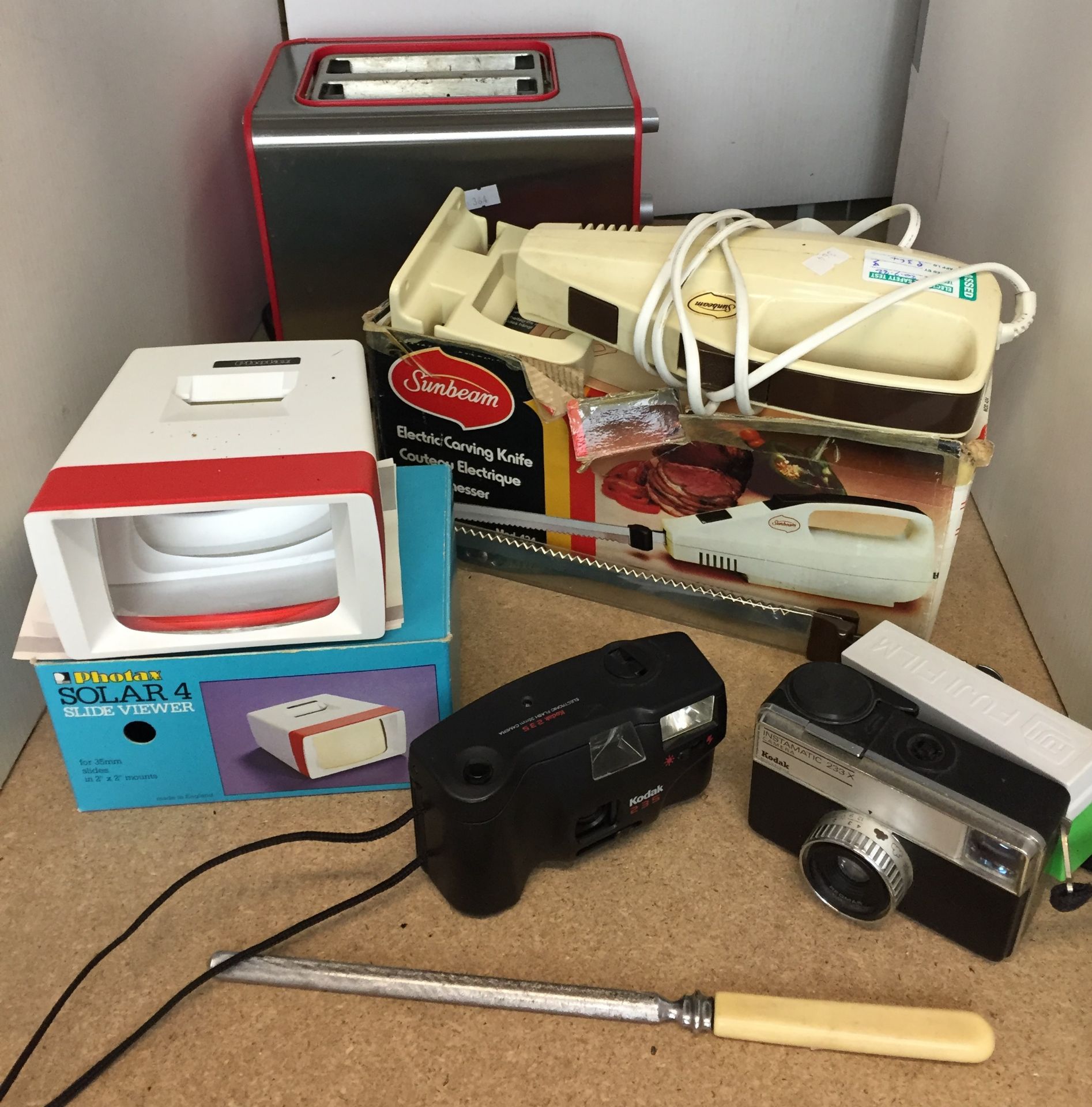 Eight items - plastic box and contents including Kodak Instamatic 233 and Kodak 235 cameras ,