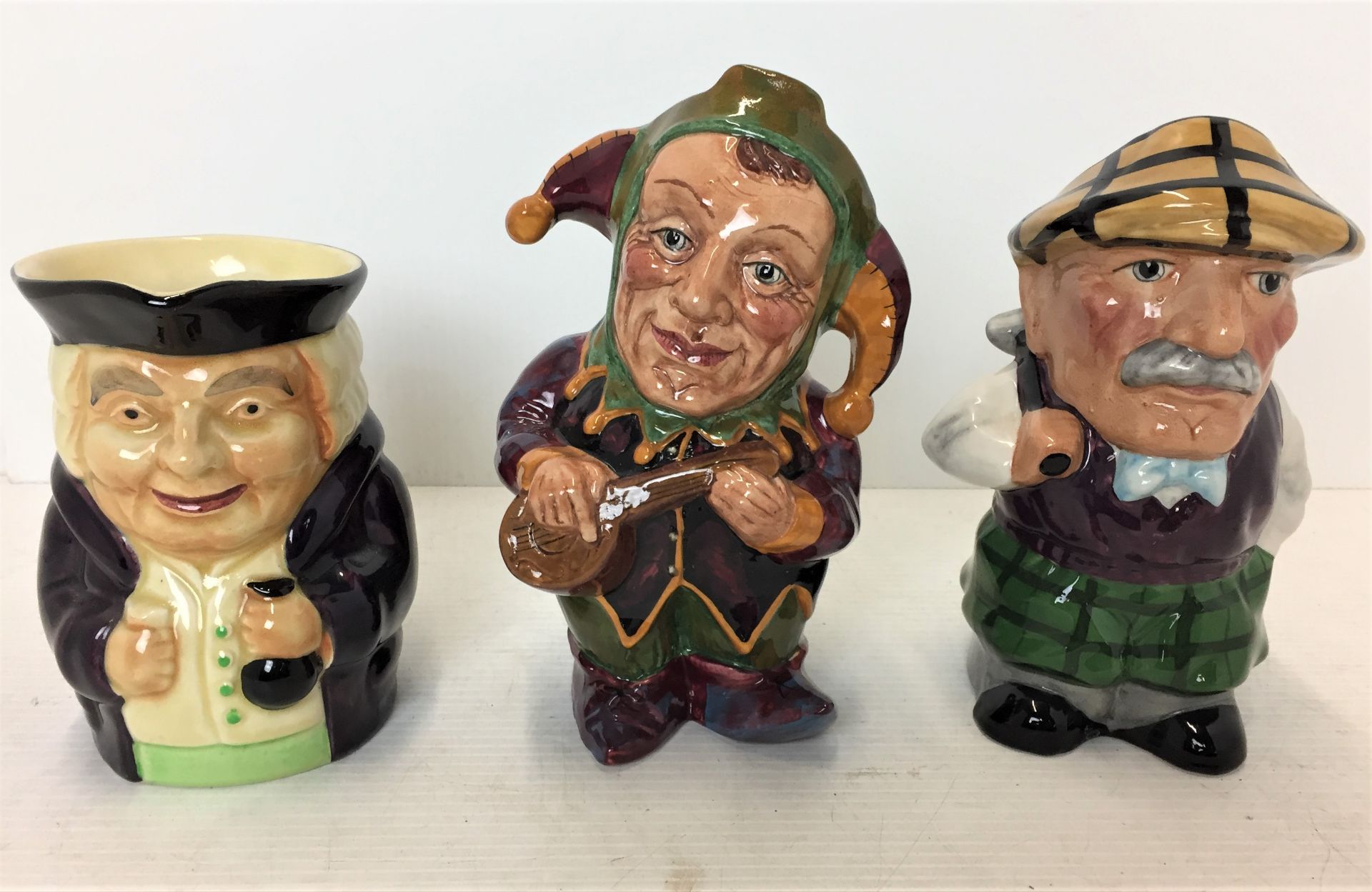 Three toby jugs two by Manor - Golfer & Jester 18cm high,