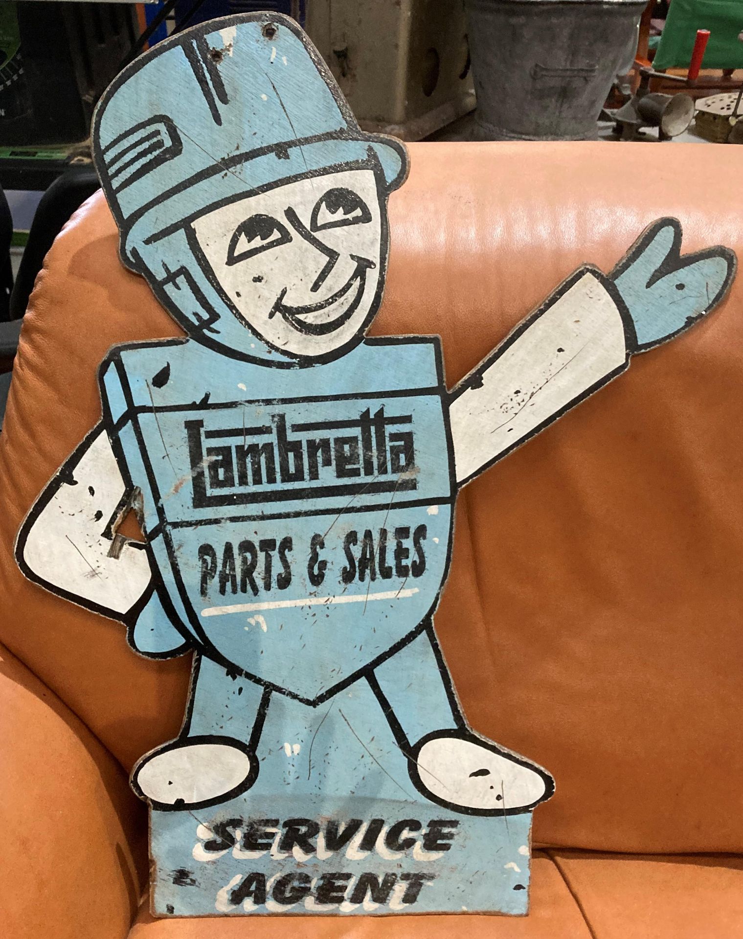 A reproduction painted sign on plywood 'Lambretta Parts and Sales, Service Agent' 65cm high.