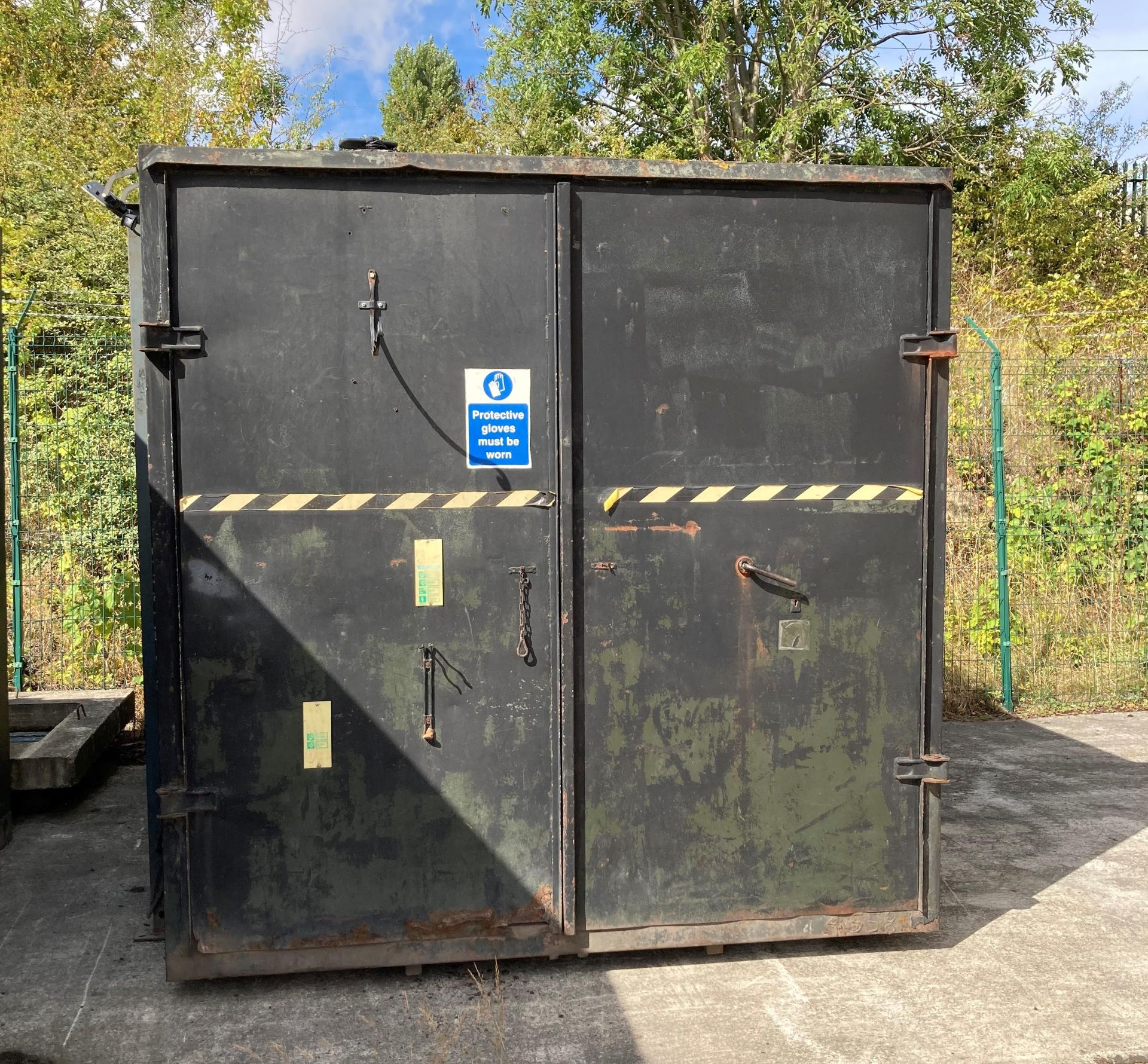 A black metal framed two door 10' container.