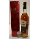 A 100cl bottle of Hine Fine Champagne Cognac 40% volume in red presentation box.