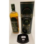 A 700ml bottle of Bushmills Single Malt Irish Whiskey aged 10 Years Triple distilled - 40% volume