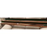 Three pool cues in two leather coated cases each approximately 155cm long.