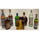Eight various bottles of spirits and liqueurs including 12.3 fl oz.