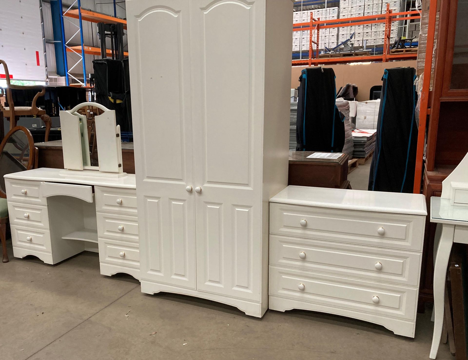 An Alstons Furniture Ltd white laminate three piece bedroom suite comprising two door wardrobe 87cm