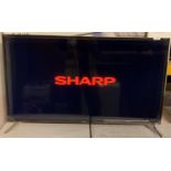 Sharp Aquos 42" Smart LED TV model: 42CG1K complete with remote and box and a Harman/Kardon built